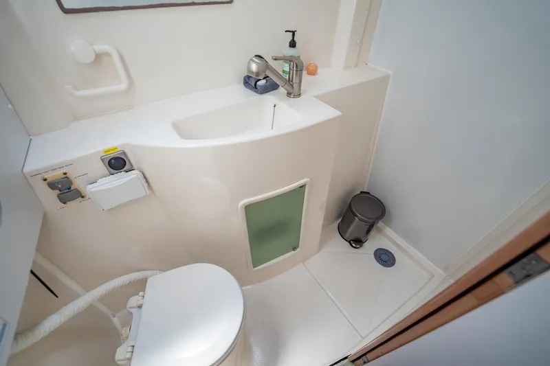 Bellamaggio Yacht Photos Pics Bathroom interior of 2008 Fountaine Pajot Salina 48 Evolution yacht, featuring sink and toilet.