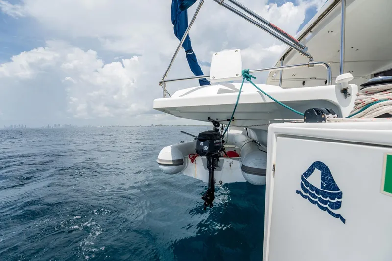 Bellamaggio Yacht Photos Pics 2008 Fountaine Pajot Salina 48 Evolution catamaran with outboard motor on calm sea.