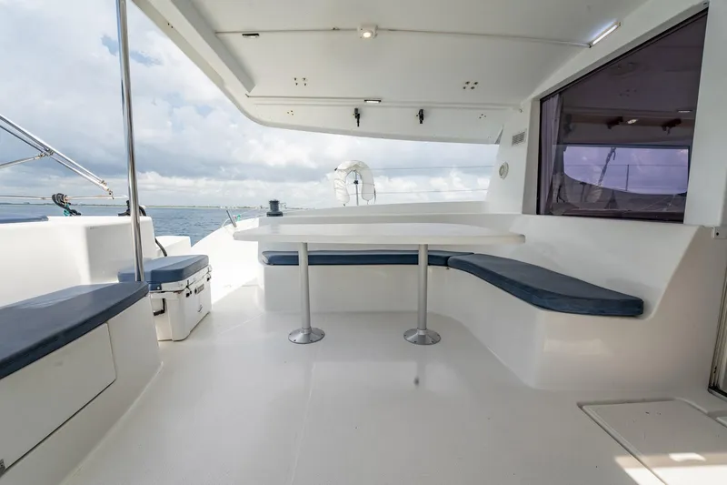 Bellamaggio Yacht Photos Pics Spacious deck area on 2008 Fountaine Pajot Salina 48 Evolution catamaran with seating and table.