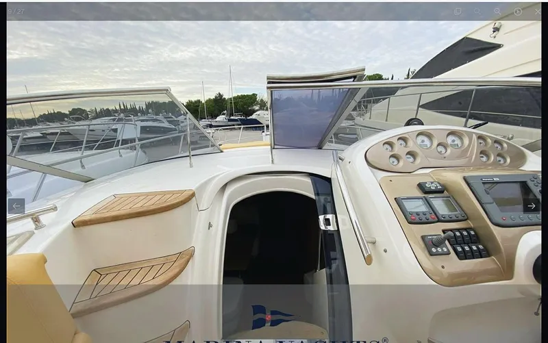  Yacht Photos Pics 2008 Sessa Marine C42 HT yacht cockpit with control panel and open cabin entrance.