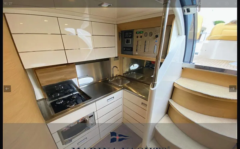  Yacht Photos Pics Modern kitchen interior of 2008 Sessa Marine C42 HT yacht with sleek cabinetry and appliances.