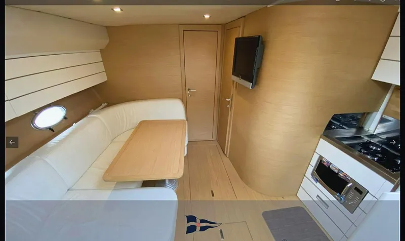  Yacht Photos Pics Interior of 2008 Sessa Marine C42 HT yacht with modern kitchen and dining area.