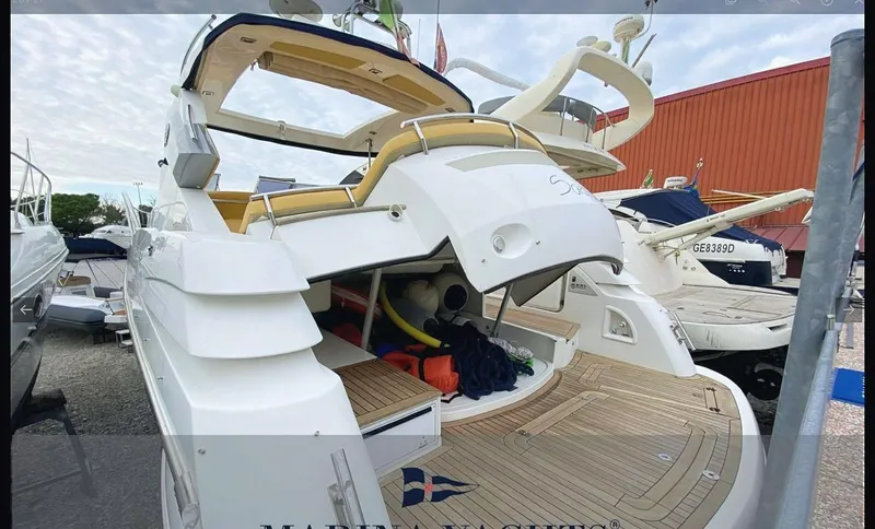  Yacht Photos Pics Sessa Marine C42 HT 2008 yacht with open deck, docked at marina.