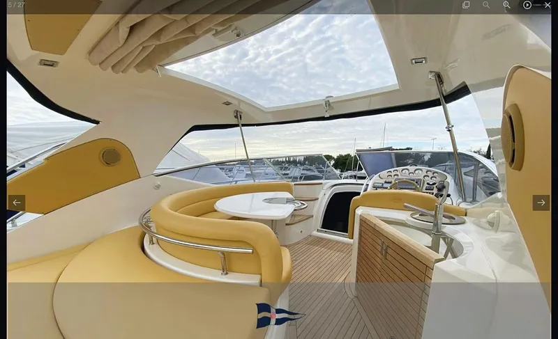  Yacht Photos Pics Luxurious interior of 2008 Sessa Marine C42 HT yacht with elegant seating and panoramic views.
