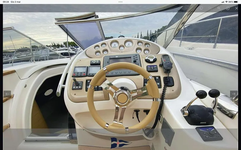  Yacht Photos Pics Cockpit of 2008 Sessa Marine C42 HT yacht with steering wheel and control panel.