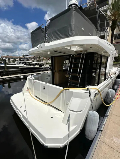 Oceans Edge Yacht Photos Pics 2022 Beneteau Swift Trawler 35 docked at marina, rear view.