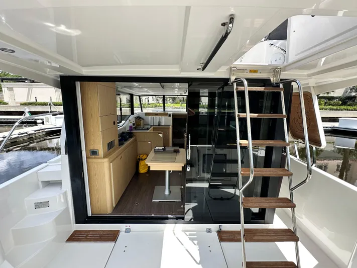 Oceans Edge Yacht Photos Pics Interior view of 2022 Beneteau Swift Trawler 35, featuring modern design and wooden accents.