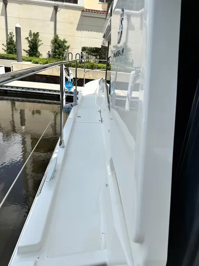 Oceans Edge Yacht Photos Pics 2022 Beneteau Swift Trawler 35 side deck view at marina.