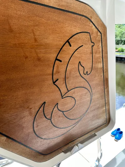 Oceans Edge Yacht Photos Pics Wooden panel with engraved seahorse logo on 2022 Beneteau Swift Trawler 35.