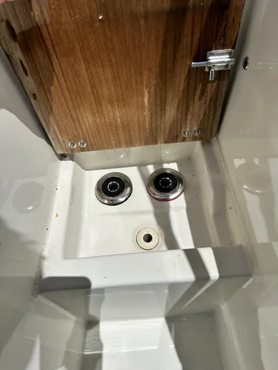 Oceans Edge Yacht Photos Pics Interior detail of a 2022 Beneteau Swift Trawler 35, featuring wooden panel and fixtures.