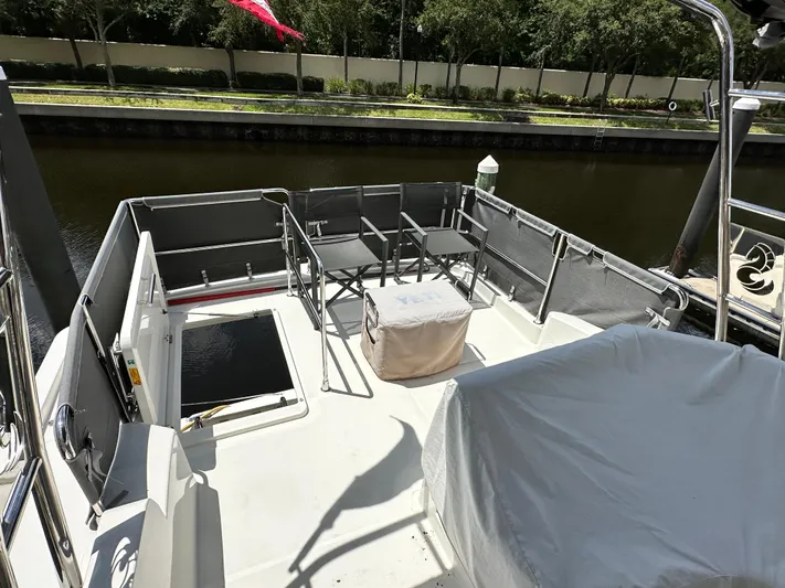 Oceans Edge Yacht Photos Pics Beneteau Swift Trawler 35 deck, 2022 model, featuring seating and covered equipment.