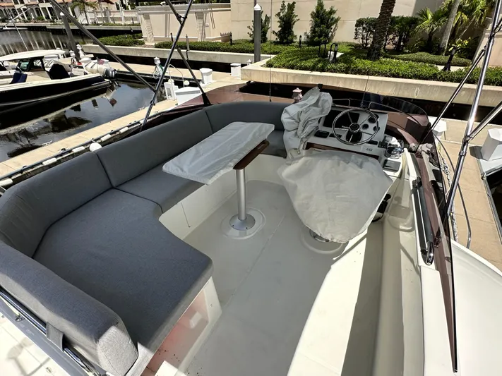 Oceans Edge Yacht Photos Pics 2022 Beneteau Swift Trawler 35 flybridge with seating and helm, docked at marina.