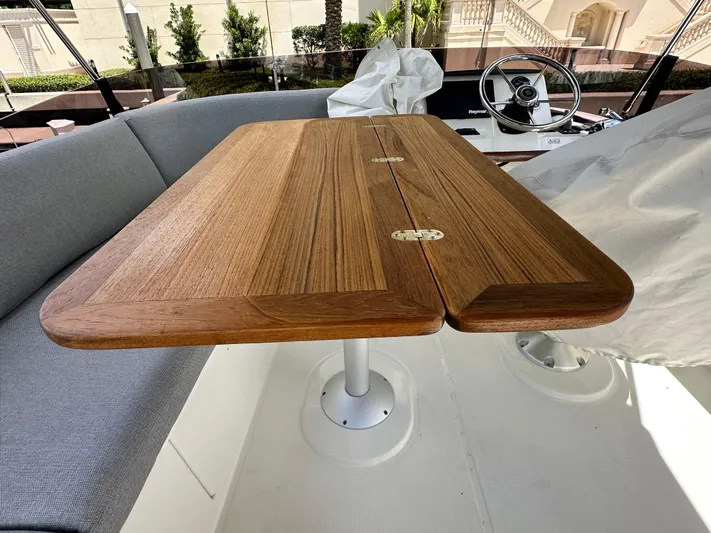 Oceans Edge Yacht Photos Pics Wooden table and seating area on 2022 Beneteau Swift Trawler 35 yacht.