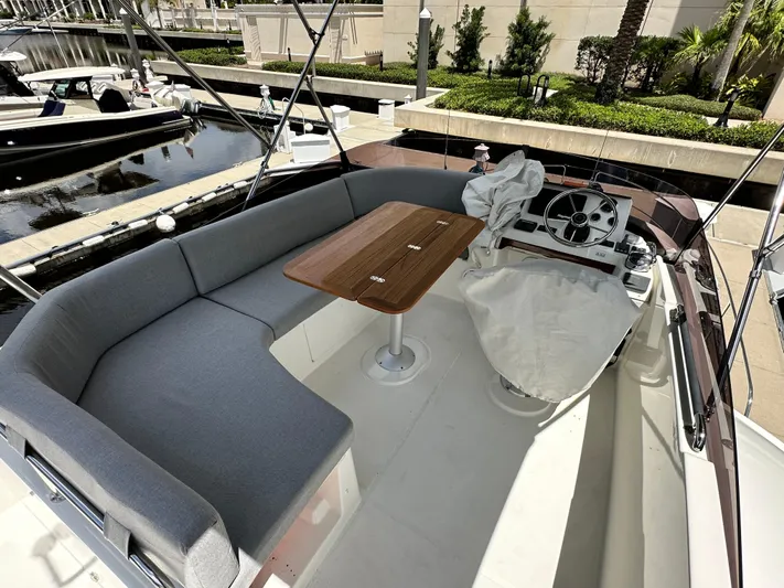 Oceans Edge Yacht Photos Pics 2022 Beneteau Swift Trawler 35 flybridge with seating and helm, docked at marina.