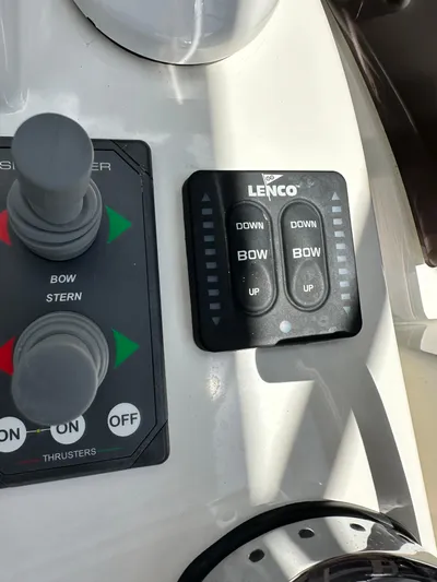 Oceans Edge Yacht Photos Pics Control panel of a 2022 Beneteau Swift Trawler 35 with Lenco trim tab switches.