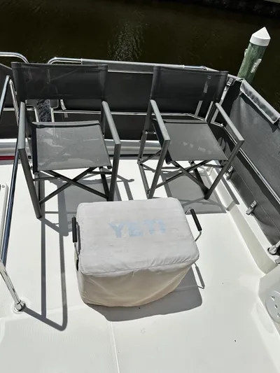 Oceans Edge Yacht Photos Pics Deck of 2022 Beneteau Swift Trawler 35 with chairs and Yeti cooler.