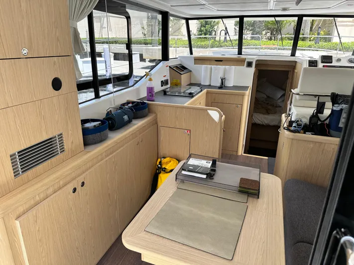 Oceans Edge Yacht Photos Pics Interior of 2022 Beneteau Swift Trawler 35, featuring modern wood cabinetry and spacious layout.