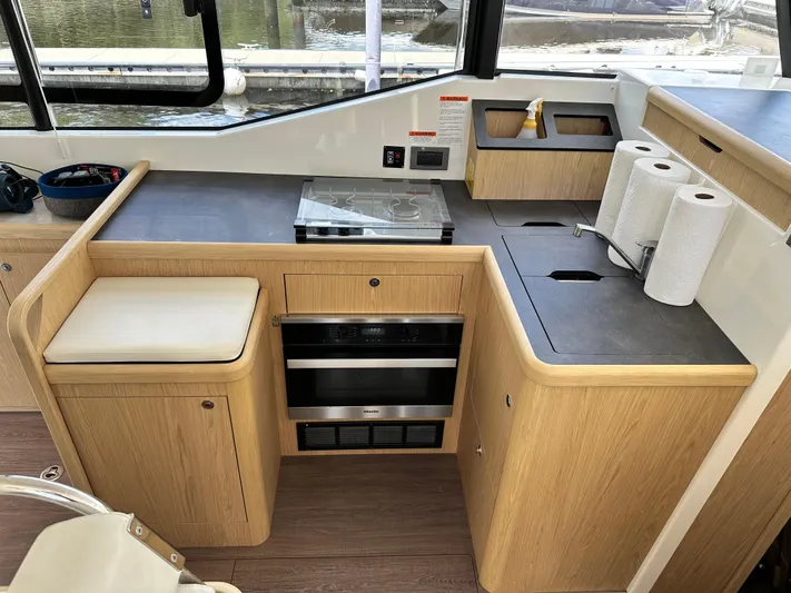 Oceans Edge Yacht Photos Pics Modern kitchen area in a 2022 Beneteau Swift Trawler 35 yacht.
