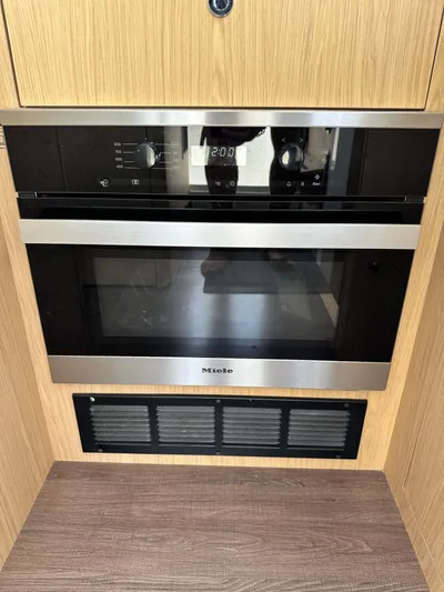 Oceans Edge Yacht Photos Pics Miele oven in 2022 Beneteau Swift Trawler 35, featuring sleek design and modern controls.