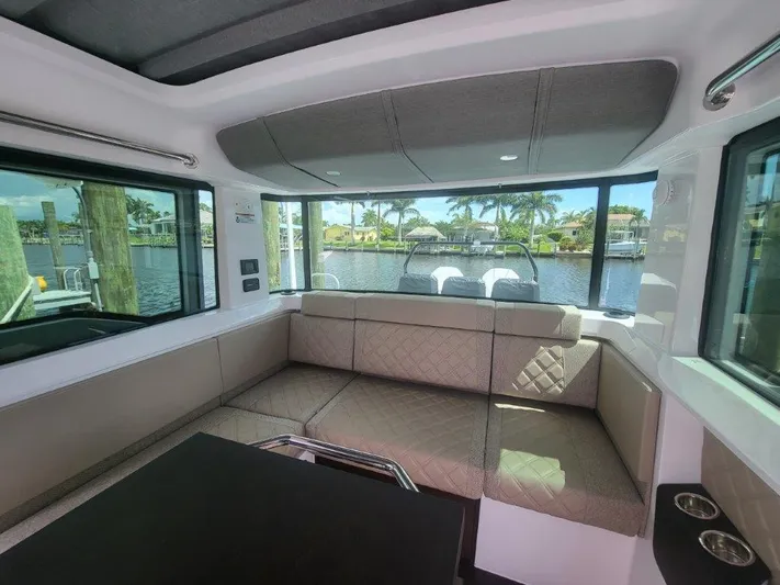  Yacht Photos Pics Luxurious interior of 2024 Axopar 37 XC CROSS CABIN with waterfront view.