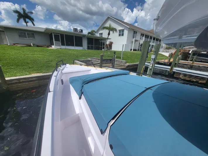  Yacht Photos Pics 2024 Axopar 37 XC CROSS CABIN docked near waterfront homes.