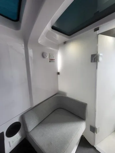  Yacht Photos Pics 2024 Axopar 37 XC CROSS CABIN interior with modern seating and sleek design.