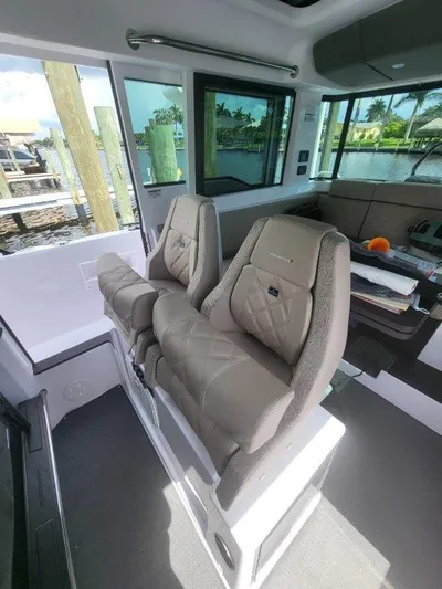  Yacht Photos Pics 2024 Axopar 37 XC CROSS CABIN interior with luxurious seating and modern design.