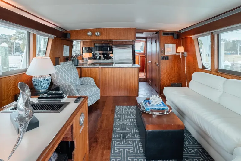Masterplan Yacht Photos Pics Luxurious interior of 1975 Hatteras 58 Long Range Cruiser with modern furnishings and elegant decor.