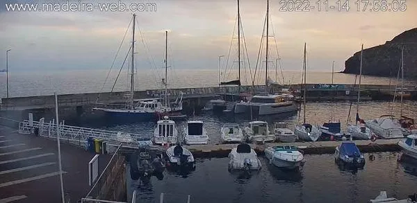 Orange Yacht Photos Pics Boats docked at a marina during sunset, Madeira, captured by Luna 47 camera.