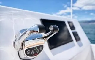 Orange Yacht Photos Pics Close-up of Luna 47 boat controls with ocean background, 2023 model.