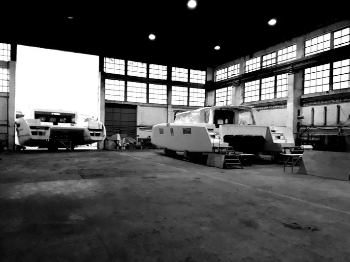 Orange Yacht Photos Pics Factory interior with Luna 47 boats under construction, 2023.