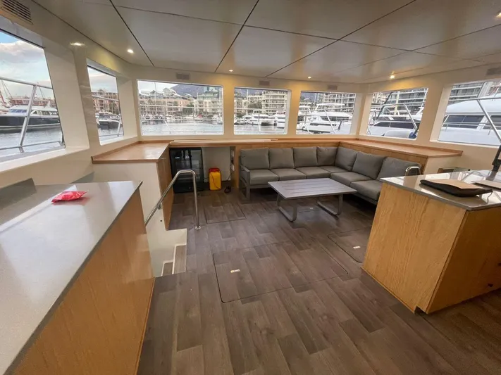 Pilar X Yacht Photos Pics Luxurious interior of 2024 Leeuwin 55 yacht with spacious seating and modern design.