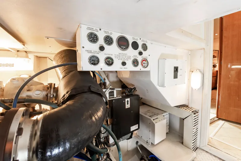 Dark Horse Yacht Photos Pics Engine room of a 2000 Viking Cockpit Sport Yacht with control panel.