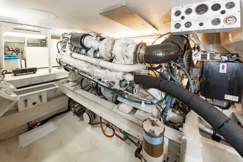Dark Horse Yacht Photos Pics Engine room of 2000 Viking Cockpit Sport Yacht with complex machinery layout.