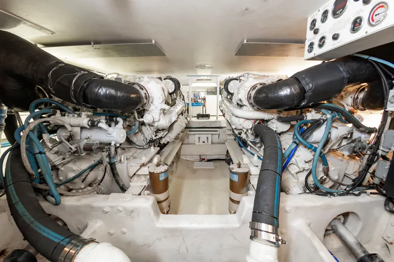 Dark Horse Yacht Photos Pics Engine room of 2000 Viking Cockpit Sport Yacht with dual large engines.