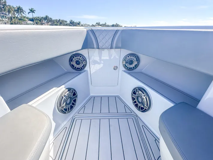  Yacht Photos Pics 2021 SeaVee 370z boat interior with speakers and cushioned seating.