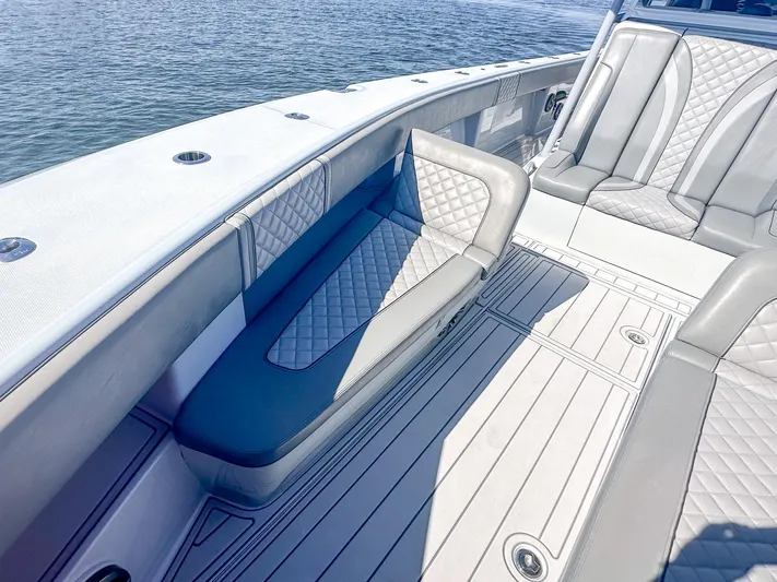  Yacht Photos Pics 2021 SeaVee 370z boat interior with cushioned seating and sleek design on the water.