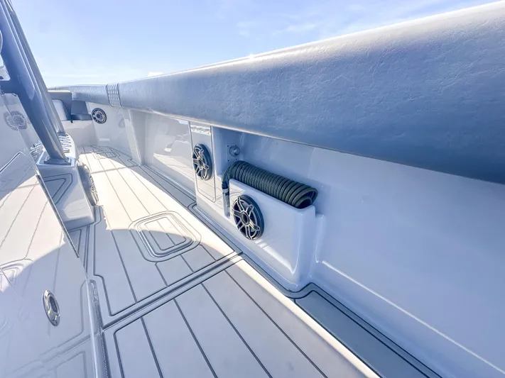  Yacht Photos Pics 2021 SeaVee 370z boat deck with speakers and storage compartment.
