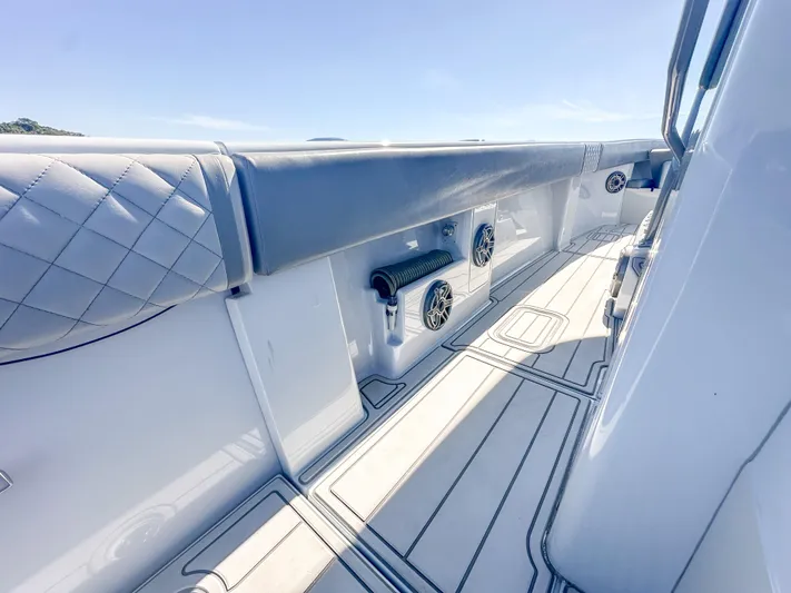  Yacht Photos Pics 2021 SeaVee 370z boat deck with cushioned seating and built-in speakers.