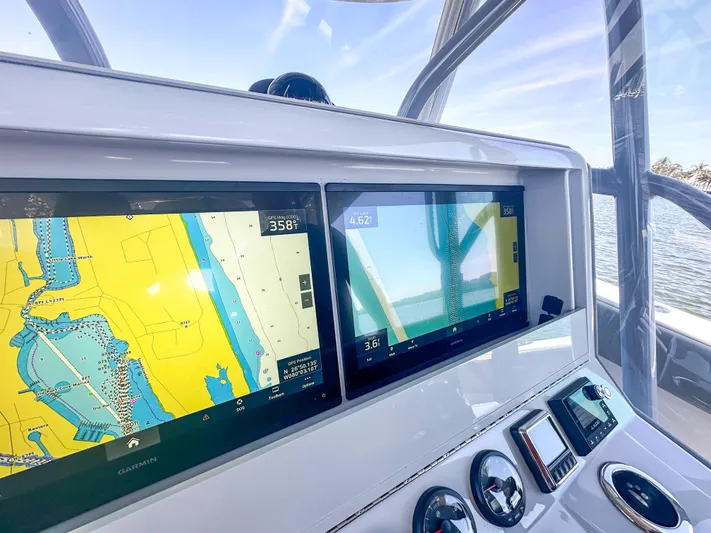  Yacht Photos Pics Dashboard of 2021 SeaVee 370z boat with navigation screens and controls.