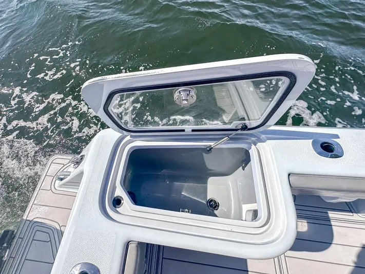  Yacht Photos Pics Open storage compartment on 2021 SeaVee 370z boat, with ocean water in the background.