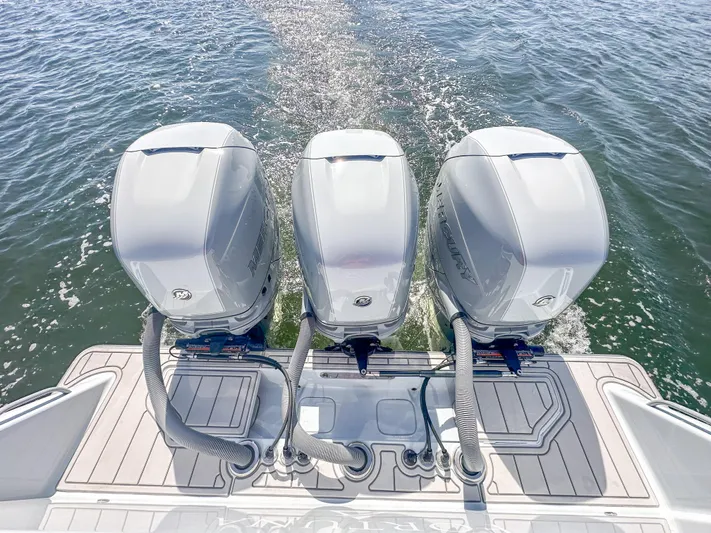  Yacht Photos Pics 2021 SeaVee 370z boat with triple outboard engines on open water.