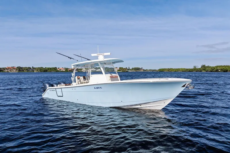 No Name Yacht Photos Pics 2023 Cobia 350 Center Console boat on calm water, clear sky background.
