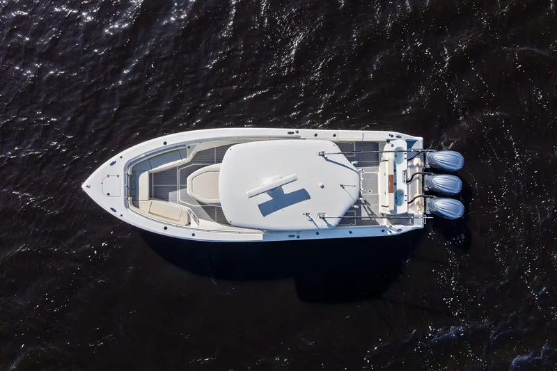 No Name Yacht Photos Pics Aerial view of 2023 Cobia 350 Center Console boat on dark water.