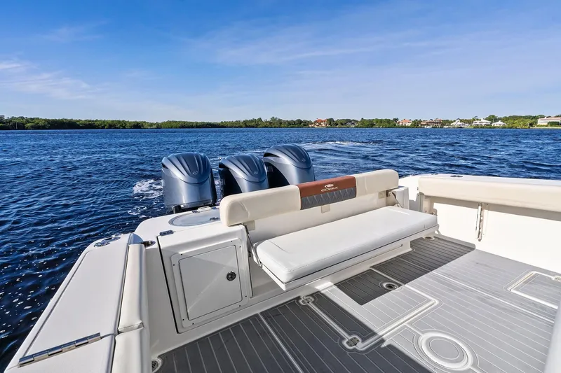 No Name Yacht Photos Pics 2023 Cobia 350 Center Console boat on open water, featuring triple engines.
