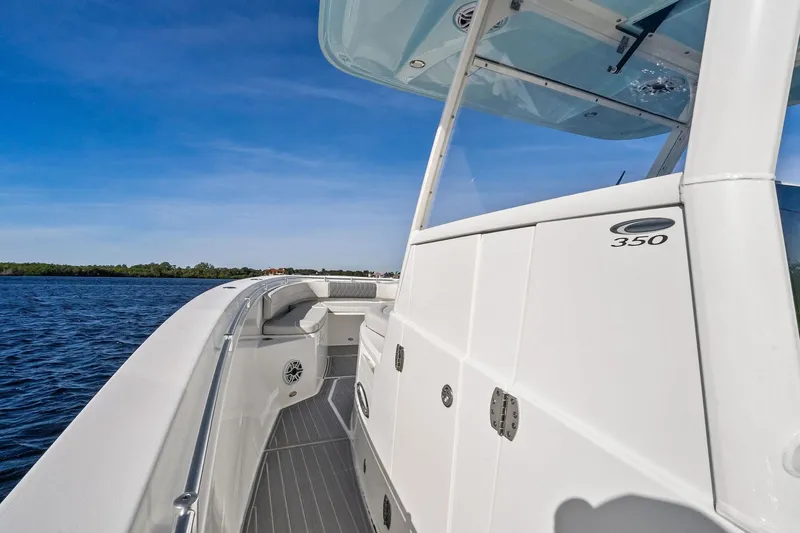 No Name Yacht Photos Pics 2023 Cobia 350 Center Console boat on water, showcasing sleek design and spacious deck.