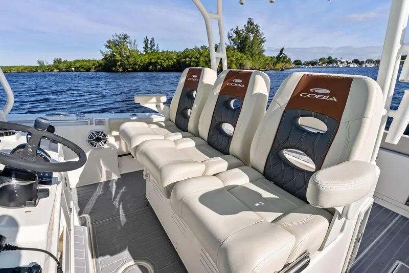 No Name Yacht Photos Pics 2023 Cobia 350 Center Console boat interior with luxurious seating and steering wheel.