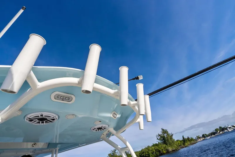 No Name Yacht Photos Pics 2023 Cobia 350 Center Console boat with rod holders against a clear blue sky.