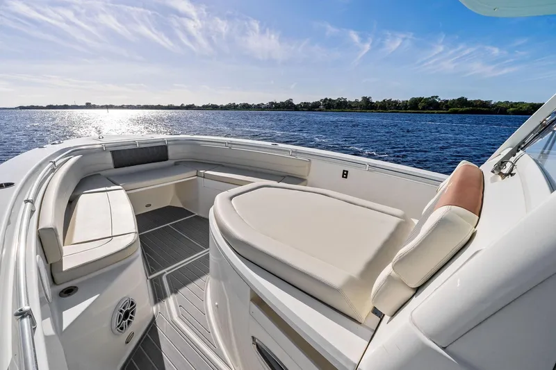 No Name Yacht Photos Pics 2023 Cobia 350 Center Console boat interior with luxurious seating on a sunny day.