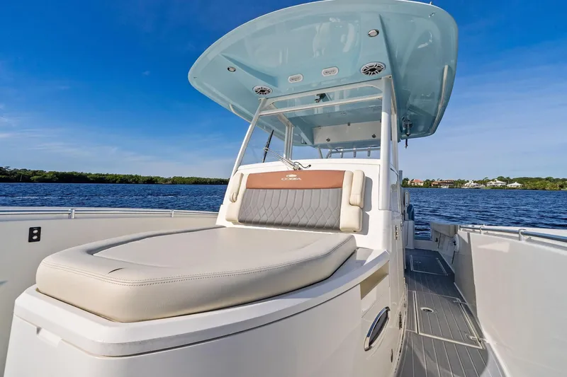 No Name Yacht Photos Pics 2023 Cobia 350 Center Console boat on water, featuring spacious seating and sleek design.